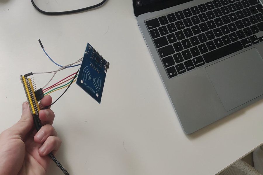 A Black Pill STM32 board wired to an RC522 RFID reader, about to be plugged into a laptop